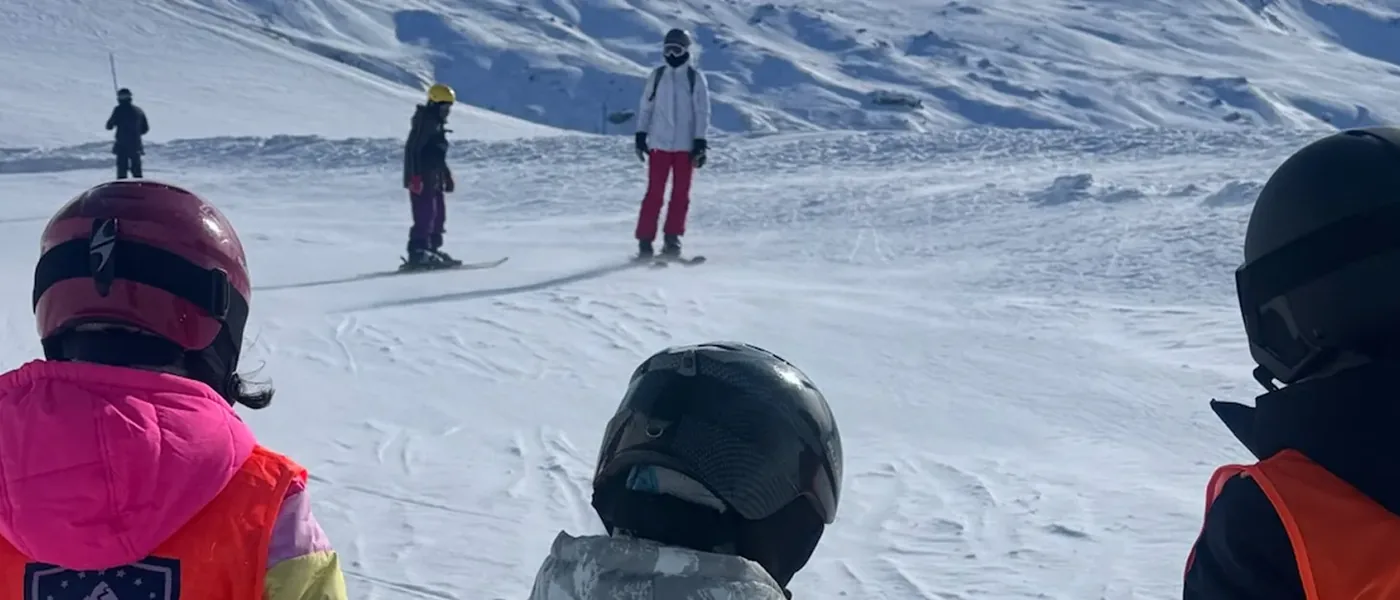 Children skiing together during a Les Alpes camp